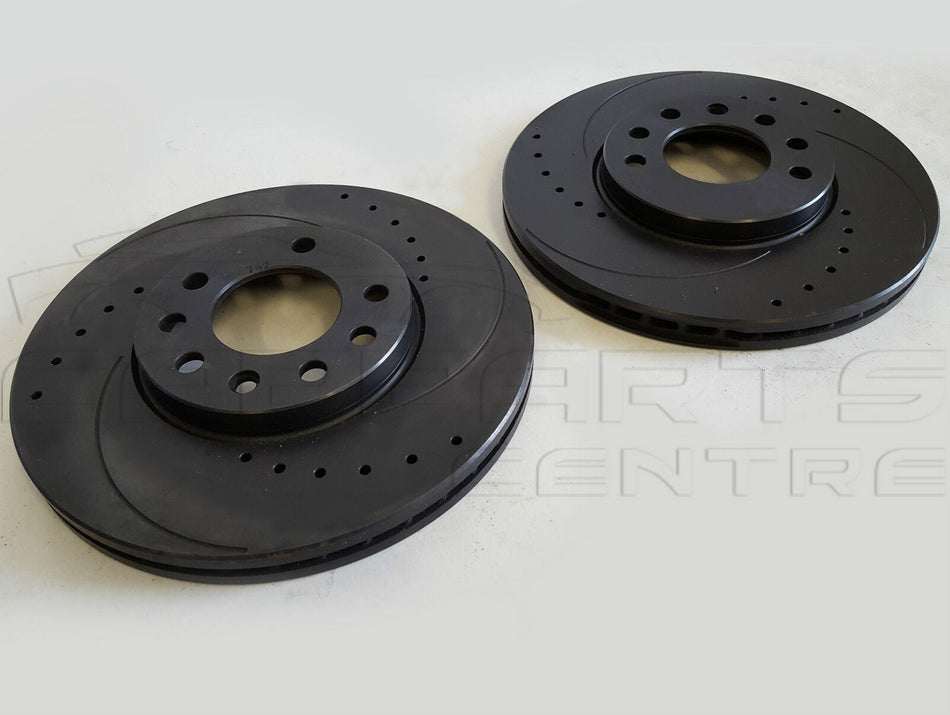Two black Vauxhall Calibra 2.5 V6 front drilled grooved vented brake rotors